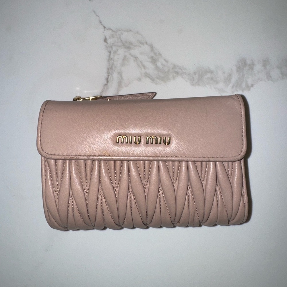 Gently used MIU MIU Matelasse wallet.